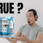 Man looking surprised while holding a box of cataract removal eye drops, questioning if the product’s claims are true